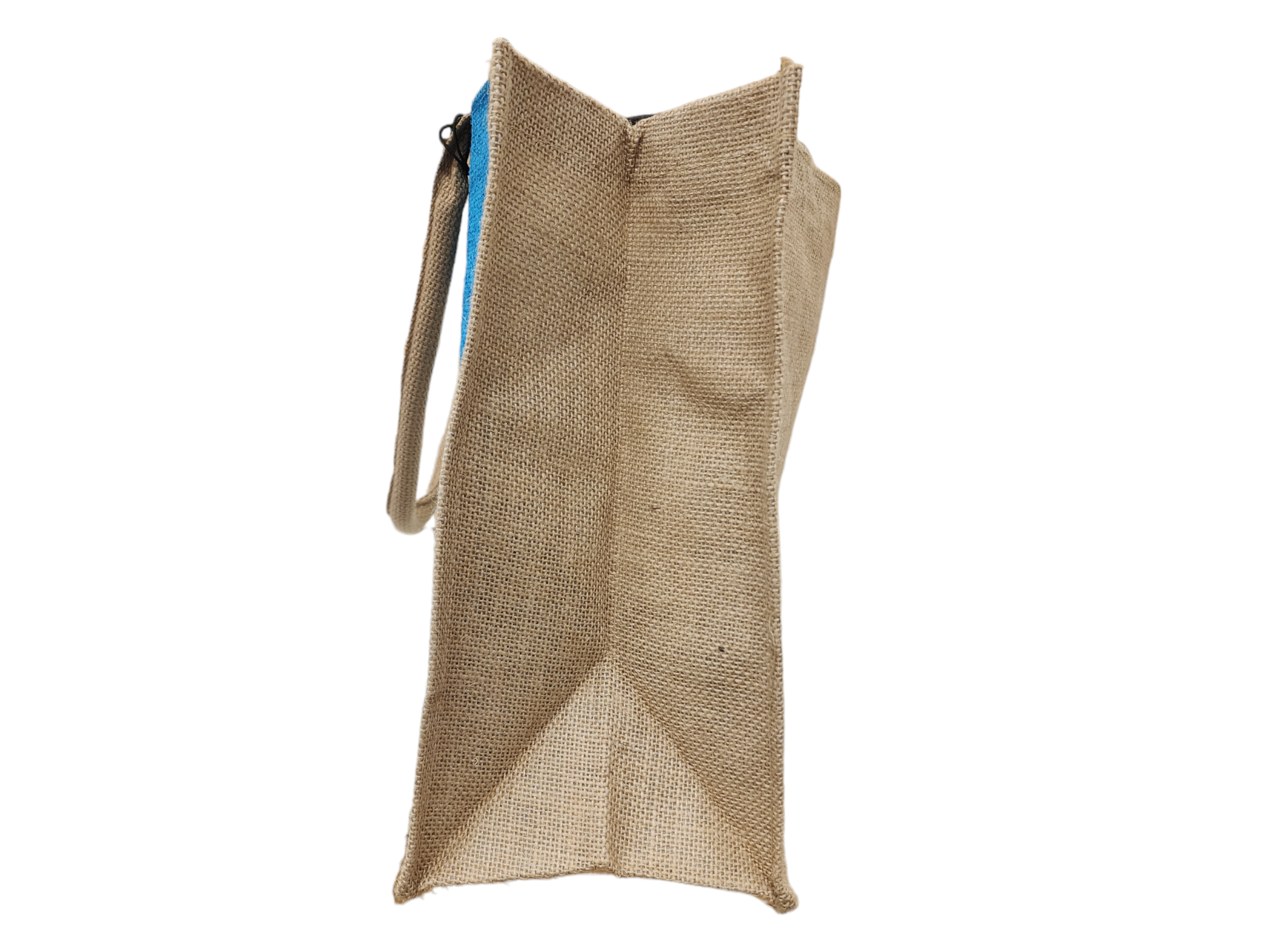 Side view of a tall beige burlap tote with blue lining peeking at the top and a slim strap.