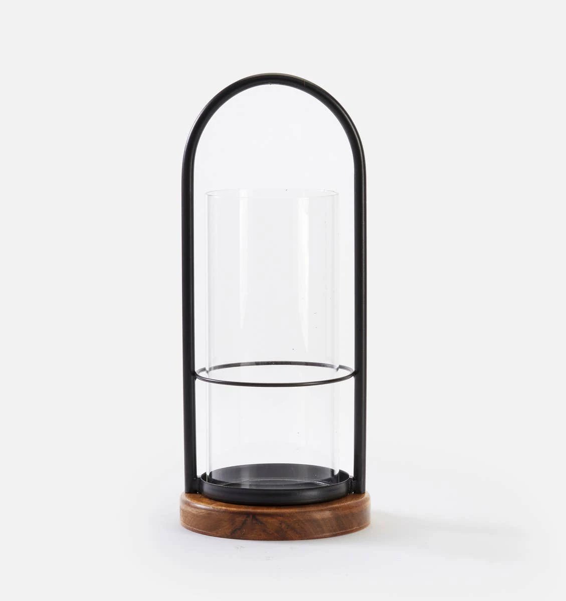 Small iron and wood candle holder: black arched frame around a clear glass hurricane on a round rustic wood base.