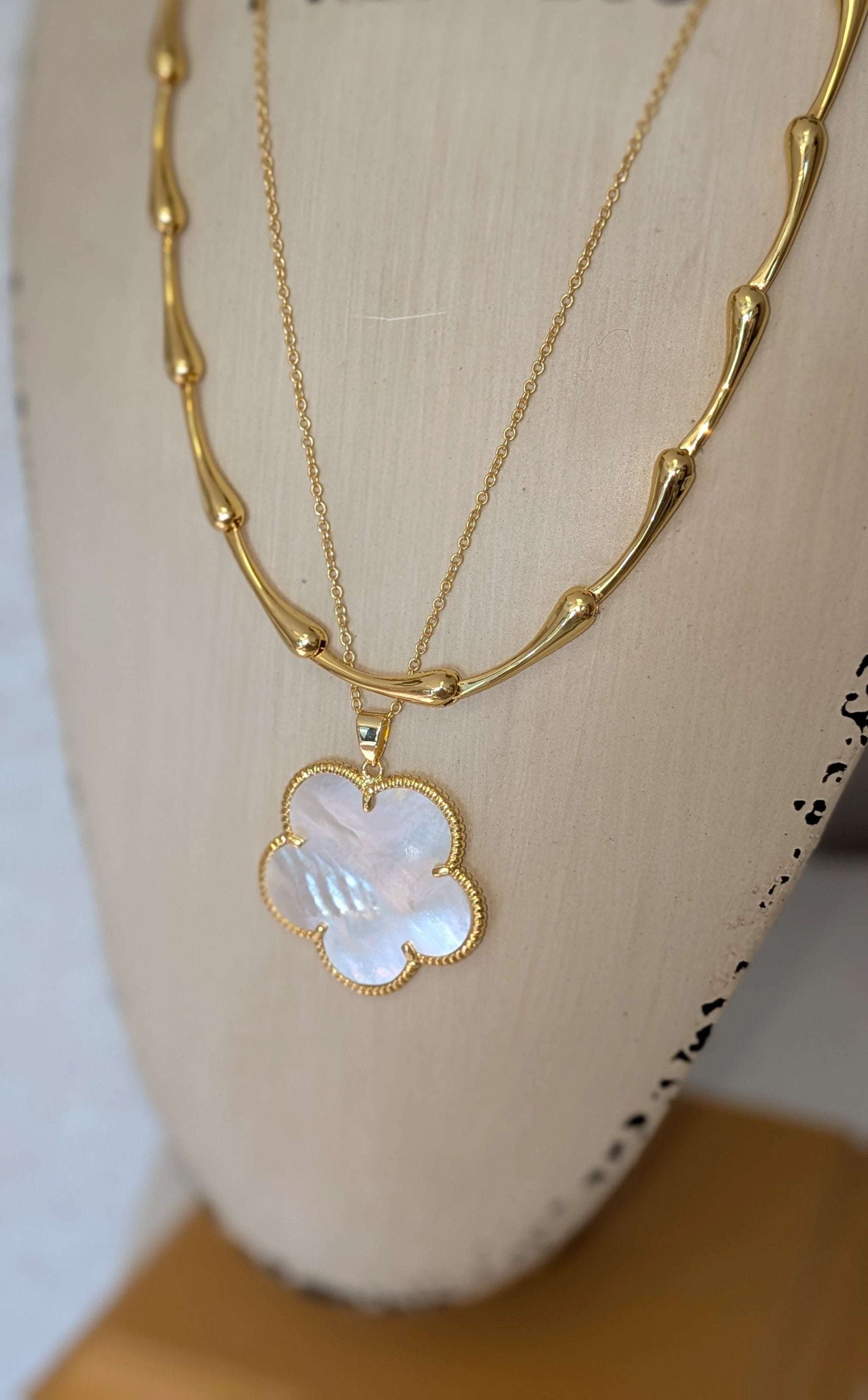 Victoria Necklace by Sahira Jewelry Design, gold-tone layered necklace with iridescent mother-of-pearl clover pendant