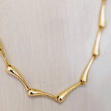 Victoria Necklace by Sahira Jewelry Design; gold-tone necklace with curved elongated links