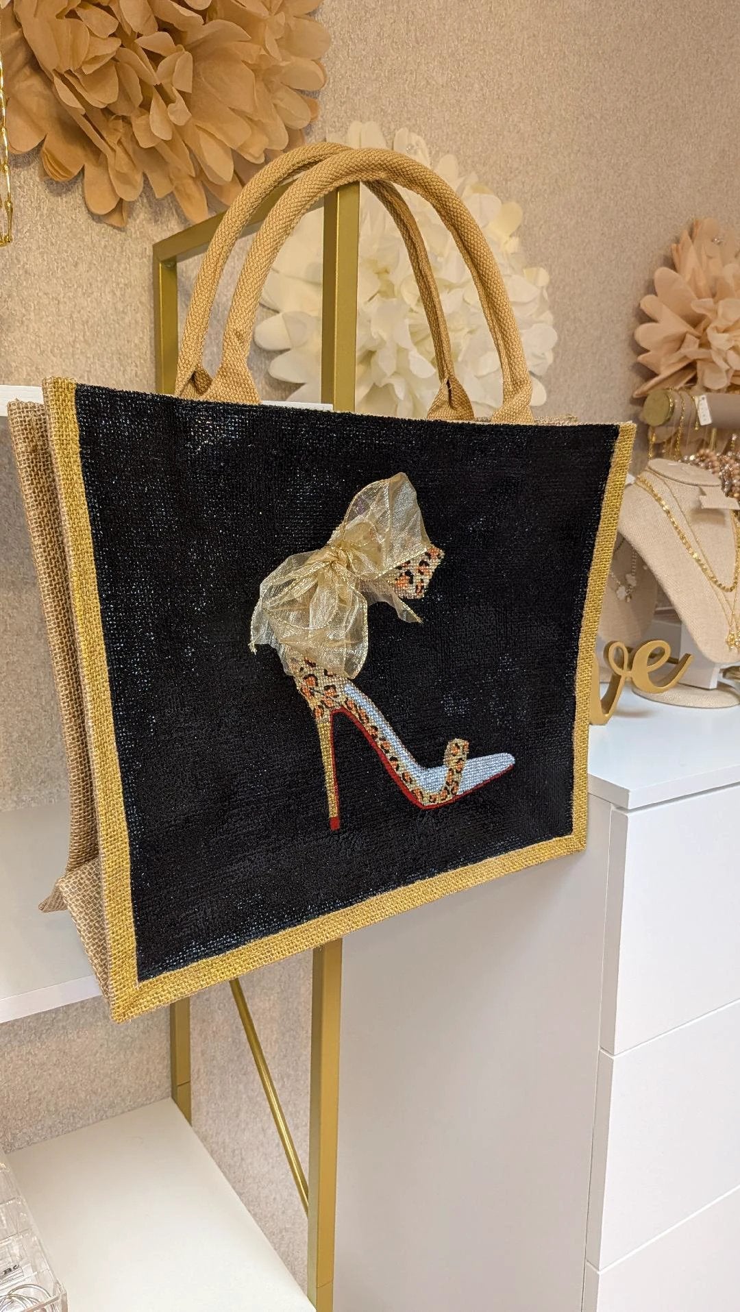 Hand-Painted Burlap Stiletto Tote Bag with black body, gold trim, beige handles, and beaded high-heel motif.